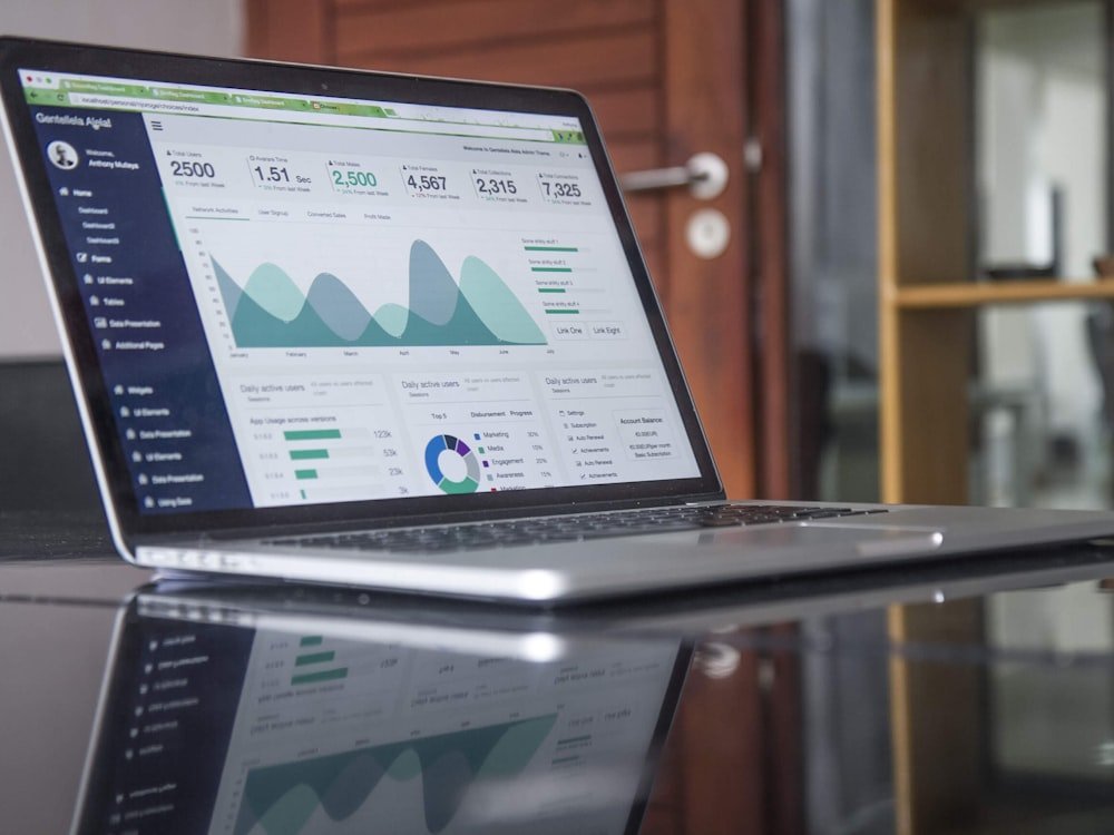 A search performance dashboard on a laptop - clicks, impressions, and conversions tracked monthly